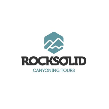 Logo of Rocksolid Canyoning Tours featuring a mountain and river icon, with black lettering and blue for the company name. | © Rocksolid